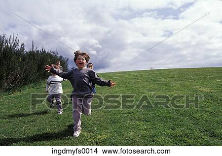 Kids Running down the Hill View Large Photo Image Picture - Kids Running down the Hill. Fotosearch