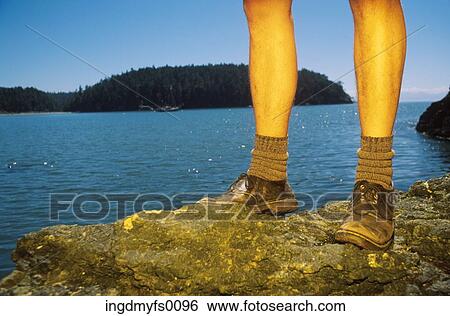 Legs of Hiker on Rocks by Ocean View Large Photo Image Stock Photograph - Legs of Hiker on Rocks by Ocean. Fotosearch