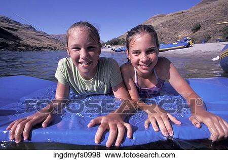 Little Girls Playing in a River View Large Photo Image Stock Photo - Little Girls Playing in a River. Fotosearch