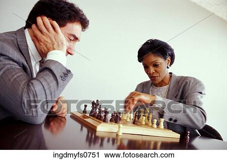 Man and Woman Playing Chess at Work View Large Photo Image Stock Image - Man and Woman Playing Chess at Work. Fotosearch