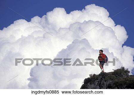 Man Hiking High in the Mountains View Large Photo Image Stock Photography - Man Hiking High in the Mountains. Fotosearch