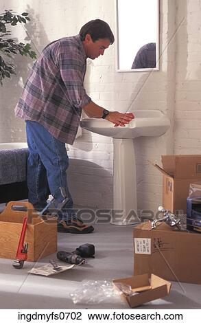 Man Installing a Sink View Large Photo Image Stock Image - Man Installing a Sink. Fotosearch