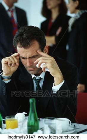 Stock Photo - Man Working During Lunch. Fotosearch
