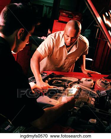 Mechanics Working on a Car View Large Photo Image Stock Image - Mechanics Working on a Car. Fotosearch