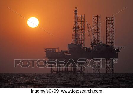 Oil Rig at Sunset View Large Photo Image Stock Photo - Oil Rig at Sunset. Fotosearch