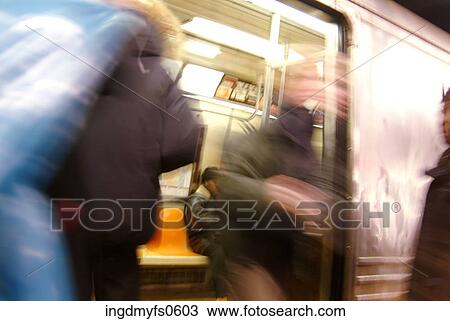 Stock Image - People Getting On and Off a Subway. Fotosearch