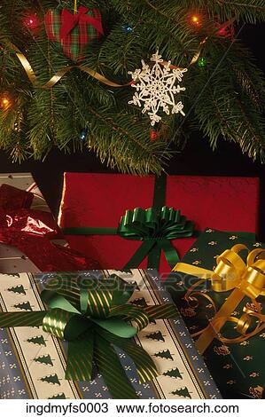 Stock Image - Presents Under the Christmas Tree. Fotosearch
