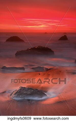 Rocks in the Sea at Sunset View Large Photo Image Stock Photo - Rocks in the Sea at Sunset. Fotosearch