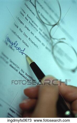 Stock Image - Signing a German Document. Fotosearch