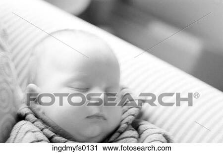 Stock Image - sleeping Baby on Couch. Fotosearch