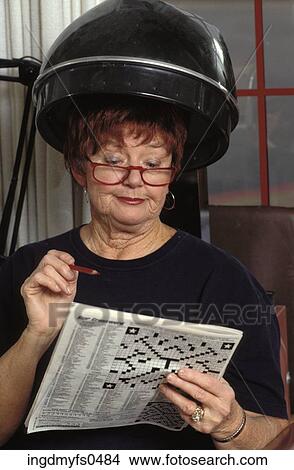 Solving the Crossword View Large Photo Image Picture - Solving the Crossword. Fotosearch