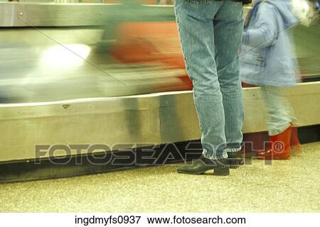 Standing at Baggage Claim with a Child View Large Photo Image Stock Photo - Standing at Baggage Claim with a Child. Fotosearch