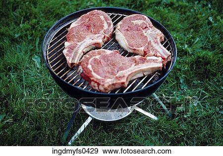 Steaks on a Grill View Large Photo Image Stock Photo - Steaks on a Grill. Fotosearch