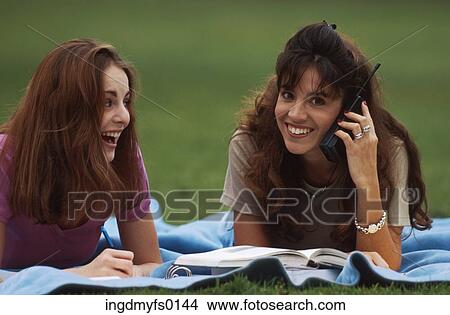 Students Outside on Cell Phone View Large Photo Image Picture - Students Outside on Cell Phone. Fotosearch