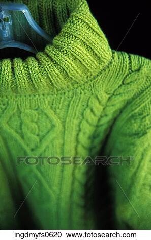 Stock Image - Sweater Hanging on a Hanger. Fotosearch
