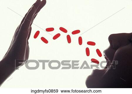 Stock Photo - Throwing Pills into Your Mouth. Fotosearch