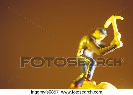 Toy Man Wielding a Pickaxe View Large Photo Image Stock Photo - Toy Man Wielding a Pickaxe. Fotosearch
