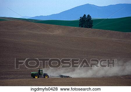 Stock Photo - Tractor In Field. Fotosearch