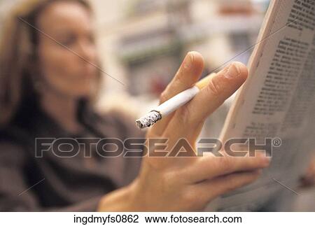 Woman Smoking and Reading the Paper View Large Photo Image Stock Image - Woman Smoking and Reading the Paper. Fotosearch