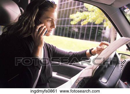 Woman Talking on Cell Phone and Looking at Map View Large Photo Image Stock Image - Woman Talking on Cell Phone and Looking at Map. Fotosearch