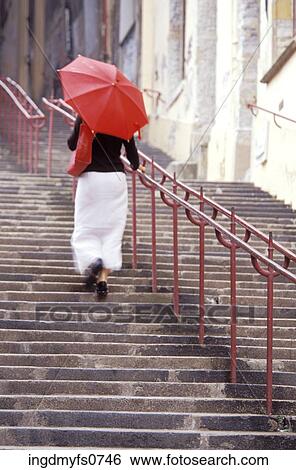 Woman Walking with Red Umbrella View Large Photo Image Stock Photograph - Woman Walking with Red Umbrella. Fotosearch