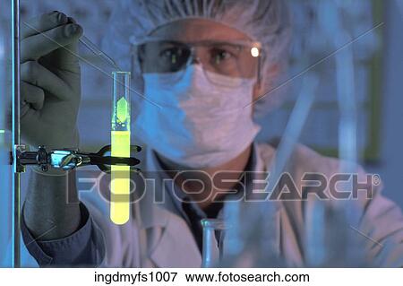 Working in a Lab with a Glowing Test Tube View Large Photo Image Stock Photo - Working in a Lab with a Glowing Test Tube. Fotosearch