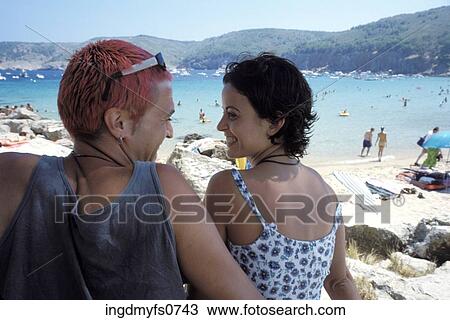 Young Couple at the Beach View Large Photo Image Stock Image - Young Couple at the Beach. Fotosearch