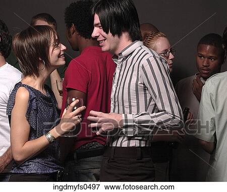 Young Couple Courting at Party View Large Photo Image Stock Photo - Young Couple Courting at Party. Fotosearch
