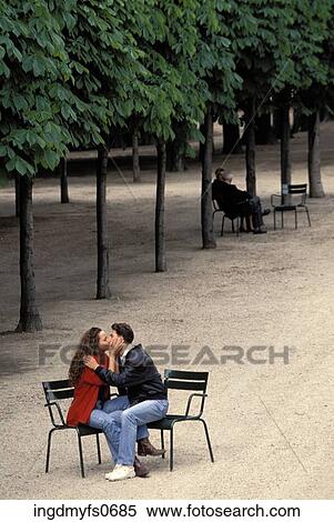 Young Couple Kissing in Park View Large Photo Image Stock Photography - Young Couple Kissing in Park. Fotosearch