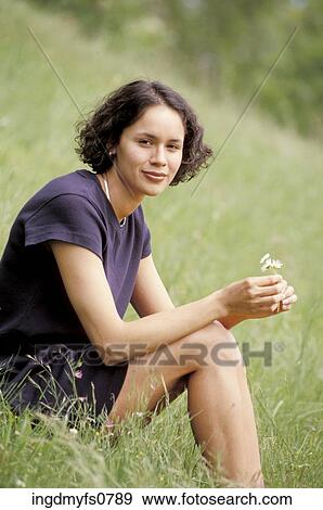 Young Woman Sitting in the Grass View Large Photo Image Stock Photo - Young Woman Sitting in the Grass. Fotosearch