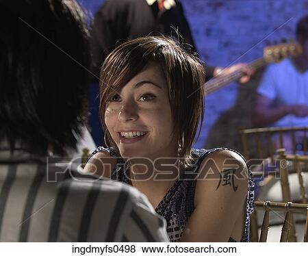 Young Woman with Tattoo View Large Photo Image Stock Photo - Young Woman with Tattoo. Fotosearch