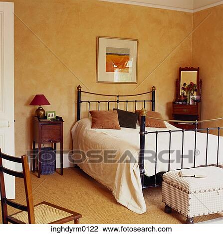 A bedroom with a wrought iron bed View Large Photo Image Stock Image - A bedroom with a wrought iron bed. Fotosearch