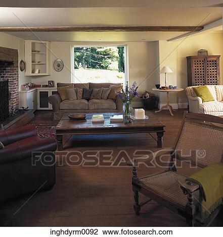A drawing room in brown tones with a wooden floor View Large Photo Image Stock Image - A drawing room in brown tones with a wooden floor. Fotosearch