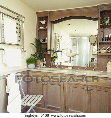 A Mirrored Cabinet Above A Wash Basin In A Bathroom Stock