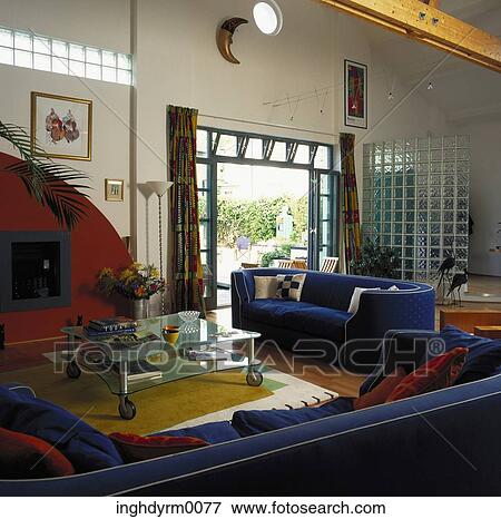 A modern drawing room upholstered in royal blue and red View Large Photo Image Stock Photo - A modern drawing room upholstered in royal blue and red. Fotosearch