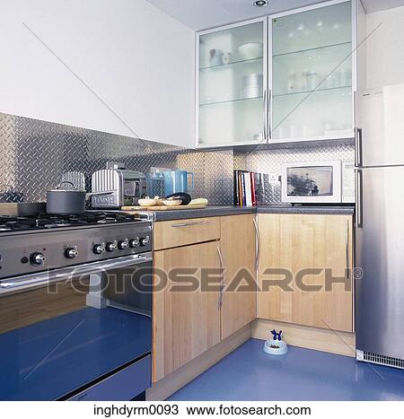 A modern kitchen with a stainless steel cooking range View Large Photo Image Stock Image - A modern kitchen with a stainless steel cooking range. Fotosearch