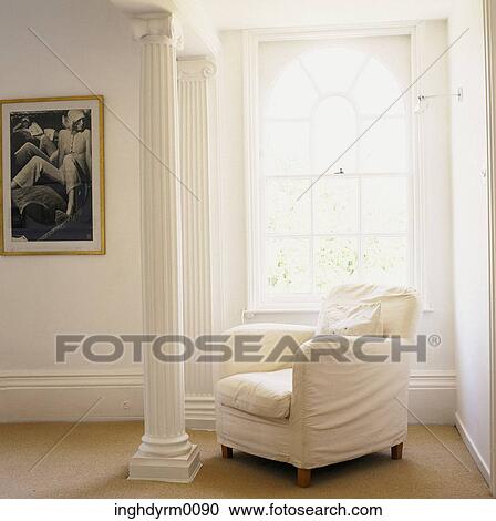 A white sofa in a corner near a carved pillar View Large Photo Image Stock Image - A white sofa in a corner near a carved pillar. Fotosearch