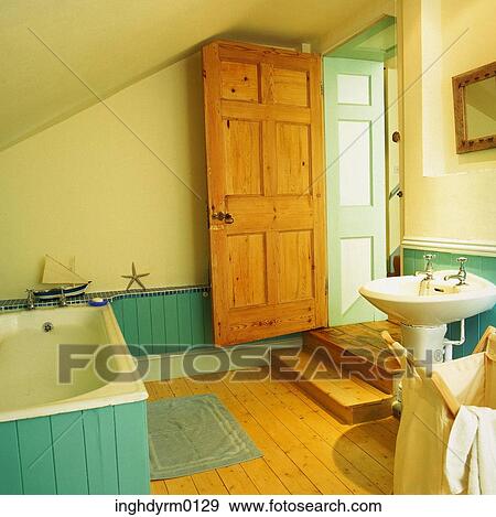 Brown and turquoise bathroom with a bathtub View Large Photo Image Stock Photo - Brown and turquoise bathroom with a bathtub. Fotosearch