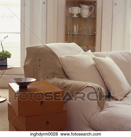 Close-up of a asymmetrical side table beside a couch View Large Photo Image Stock Photo - Close-up of a asymmetrical side table beside a couch. Fotosearch