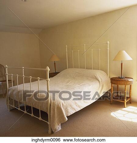 Close-up of a white painted wrought iron bed View Large Photo Image Stock Photograph - Close-up of a white painted wrought iron bed. Fotosearch