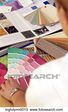 Close-up of a woman looking at shade cards of paints on a table View Large Photo Image Stock Image - Close-up of a woman looking at shade cards of paints on a table. Fotosearch