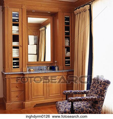 Close-up of a wooden cabinet along a wash basin View Large Photo Image Stock Photograph - Close-up of a wooden cabinet along a wash basin. Fotosearch