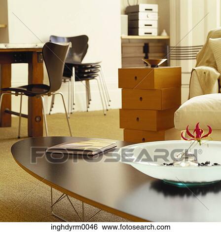 Close-up of an abstract flower display on a living room coffee table View Large Photo Image Stock Photograph - Close-up of an abstract flower display on a living room coffee table. Fotosearch