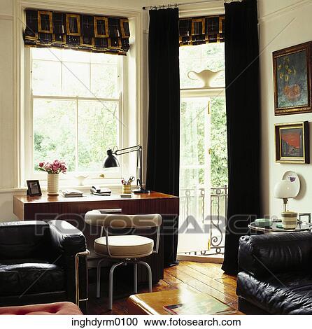 Stock Image - Leather sofas in a study. Fotosearch