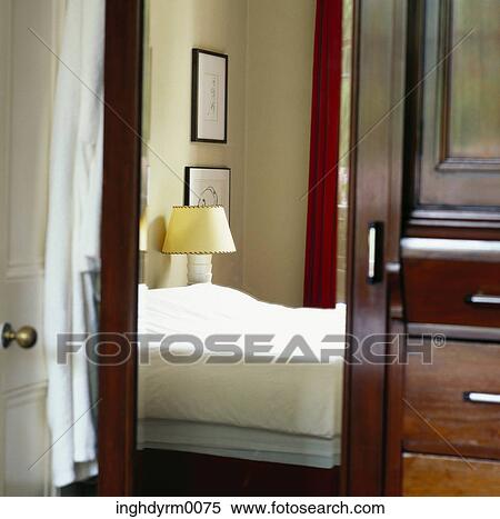 View of a bed in a cupboard mirror View Large Photo Image Stock Photography - View of a bed in a cupboard mirror. Fotosearch
