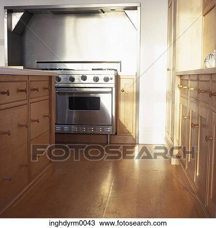 View of a cooking range installed in a wooden kitchen View Large Photo Image Stock Image - View of a cooking range installed in a wooden kitchen. Fotosearch