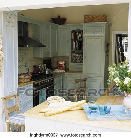 View of a country style kitchen with fresh baguettes on the counter View Large Photo Image Stock Photo - View of a country style kitchen with fresh baguettes on the counter. Fotosearch