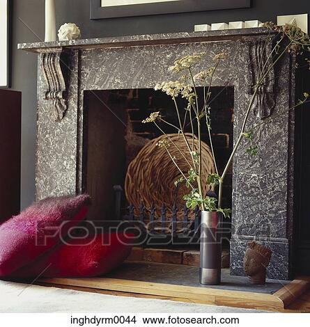 View of a fireplace with an ornate mantle View Large Photo Image Picture - View of a fireplace with an ornate mantle. Fotosearch