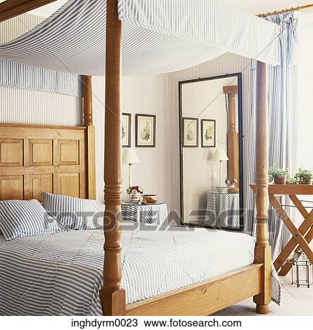 View of a four poster bed covered in stripes View Large Photo Image Stock Image - View of a four poster bed covered in stripes. Fotosearch