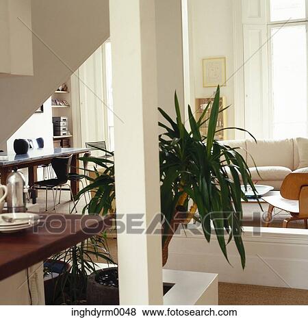 View of a living room, seen through the kitchen View Large Photo Image Stock Photo - View of a living room, seen through the kitchen. Fotosearch